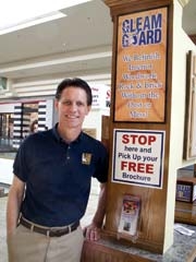 Gleam Guard owner Tracy Booth in the Promenade Mall kiosk by the food court.