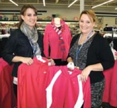 First Assistant Michelle MacKool and Store Manager 
Jaime Monroe show off active wear items in Goodwill’s Southwest Boulevard retail store.