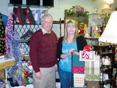 Wayne McCombs, director of the J.M. Davis Arms &amp; ­Historical Museum, and 
Holly Thompson, owner of Dorothy’s Flowers, show off a few of the items visitors will find at the ­Valentine’s Day Arts and Craft Show.