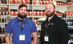 Andrew Northup, store manager of the new midtown Tulsa GNC, and Robb Winn, 
regional manager.