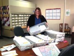 Julie Dermody, secretary of the Rogers County Election Board, mails information to voters who were a part of the massive redistricting process.
