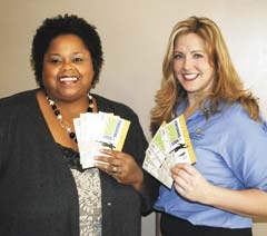 Vanessa Komara and Tammy Fate display tickets for the two-day 2011 Broken Arrow Business Conference sponsored by the Broken Arrow Area Chamber of Commerce.