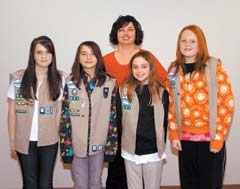 Members of Girl Scout troop #641 and their leaders received ­certificates of commendation for volunteering their time to paste labels in free books given away to children during several literacy events last year, including Claremore’s Christmas parade. The Scouts also walked in the parade and helped distribute the books to children along the route. (L to R): Brianna Gaines, Rachel Seitz, Kayla Harding and Krissa Nickles, along with troop co-leader Jodie Seitz. (Not pictured): Madison Chase, Jolissa Hall and troop co-leader Robin Chase.