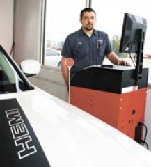 South Pointe Chrysler Jeep Dodge Service Technician Lance Young conducts brake, alignment and sideslip testing on a vehicle using computerized Hunter Inspection Lane equipment.