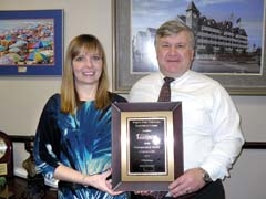 RSU Innovation Center Director Jeri Koehler presents City Manager Jim Thomas with a plaque recognizing Claremore as the state’s first Entrepreneur Ready Community.