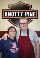 Owner Jim Rice and server Carrie Burr have enjoyed long associations with Knotty Pine Barbeque.