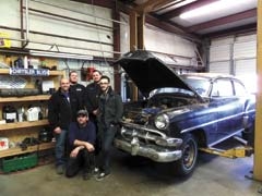 The staff of Owasso Auto Care: (front) Billy, (middle) Tim Sr., Tim Jr., (back) Mike and David.