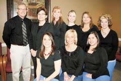 The friendly, professional staff of A Family Dentist in Broken Arrow includes (L to R, seated) Kendall, Joni, Fran, (standing) Dr. Dennis Carlile, Karen, Kathleen, Natalia, Gwen and Nikki.