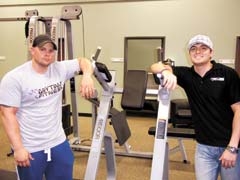 Personal trainer Jared Yates and owner Skip Lee at Owasso’s newest workout facility, Anytime Fitness.