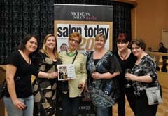 The Ihloff management team accepts the Salon Today 200 award in New Orleans. 
(L to R): Tracy Berryhill, Utica location manager; Stacy Soble, “Salon Today” editor; ­Marilyn Ihloff, salon owner; Sheri Carr, Norman location manager; Christin Richardson, Utica ­assistant manager; and Terri Vajda, communication center manager.