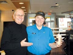 McDonald’s owner Tim Rich and his employee Debi Wilks with the new caramel frappé.