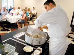 Eli Huff of Oscar’s Gastropub presenting a cooking demonstration in CFBEO’s Culinary Center in 2009.