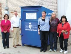 Standing beside one of their Thrift Harbor blue collection boxes are Thrift Harbor team members (L to R): Kim Prock, store manager; Titus Robison, Hope Harbor executive director; Mary Baumgardner, store volunteer coordinator; and volunteers Diane Lynch and Crystal Dancer.