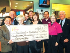 (L to R) Luis Perez, McDonald’s Corp. business consultant; Carolyn Zumwalt, employee of the year; Tim Rich, owner; Daniel Schwartz; Chris Rich; Patty Rich, owner; Glen Schwartz; and 
Beverly and Harry Lossing share in the excitement of the check presentation.
