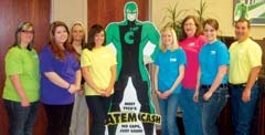 Staff of TTCU of Claremore, a Destination Claremore sponsor (L to R): Ashley Carter, Heather Garrison, Lisa Dennis with the Claremore CVB, Amanda Rue, ATEM Cash (in the middle), Ashley Lowther, Sheri Bunch, Sarah Wright, and Branch Manager Bryan Bradley.