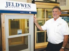 Mill Creek Sales Representative Larry Graham shows an aluminum clad wood window by JELD-WEN.