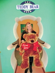 Board President Adrienne Barnett is joined by one of many comforting bears at the Children’s Advocacy Center.