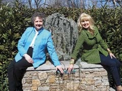 Judith Carter, president of the Tulsa Garden Club, and Breniss O’Neal, landscape designer, in Breniss’s garden, where the Garden Tour Patrons’ Party will be held on Friday, April 24. 
(Photo by John T. Carter)