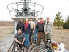 Volunteer coordinator Mark Allen (kneeling) is joined by volunteers Jack Crocker, Leilani Allen, Ed Williams, Wesley Green, Brandt Hopper and Jason Denno.