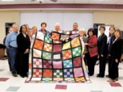 The Creek County Literacy Program’s board of directors holds a quilt made by learners and tutors that will be up for auction at the 13th annual Creek County spelling bee. (L to R): (front row) Lashikia Lynch, Sue McCullough, Barbara Belk, Cookie Jobe, Debbie Marshall, Barbara Morris, (middle row) John Mark Young, Lois Thurston, (back row) Tiffany Owen, Linda Rankin, Nancy Landholt, Cynthia Holtwick, Mack McCullough, and Chuck Mitchell.