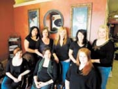 The staff of Hideaway Salon (L to R): (front row) Crissy Rowland, Heather Ferrell, Ashley Keeler, (back row) Marcia Prado, owner Tammy Calsing, Cheri Howery, Tianne York and Donna Lee.