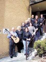 Board members for this year’s Relay For Life (L to R): (Back row against wall): Event Chair Roger Evans with guitar to be personalized by Garth Brooks, Cathy Cooksey, Marilynn Gibson, Paula Detherow, Cindy Kennedy, Christine Day, (Front row) Amie Woodward, Event Chair Cheryl West, Pam Blackburn, Mary Kelly and Sonja Redding.