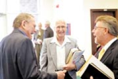 Norman Eslinger (left) of WBC welcomes Steve Matney (right) and Harold Carlton (center) of BFC as they celebrate the reunification of the two churches over the last few weeks.