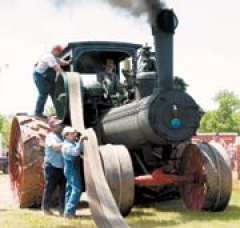 OSTGEA members Carl Tuttle (in cab), Rick Hasbrook (on tire), Greg Tuttle and Jeff Detwiler (front).