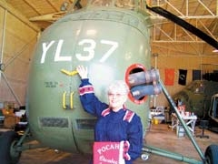 Lili Hale, Pocahontas Club member dressed in traditional Cherokee garb, stands in front of the YL37 Marine Sikorsky UH-34 D Viet Nam helicopter, which will be on display at the club’s annual picnic on May 15.