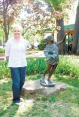 Property Manager Jessica Judd stands on the beautiful grounds of Utica Square, host of the second annual Spring in the Square on Saturday, May 15 from 10 a.m. to 5 p.m.