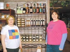 Hazel and Leslie encourage sampling and snacking at the Nut House tasting event on May 6.