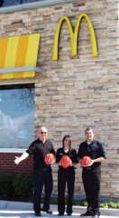 Tim Rich, owner of the Owasso McDonald’s ­locations; Shannon ­McDonald, general ­manager; and Glenn Schwartz, director of ­operations, are ready to give away 500 youth ­bicycle helmets on ­Saturday, May 11 in a lot just west of the 76th Street North restaurant. ­