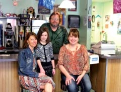 Rick Willaby, Boomarang Diner manager, and Cari ­Bohannan, daughter Taylor, and Susan Todd smile as they invite people to check out their businesses. Bohannan and Todd are co-owners of Nesting Necessities.