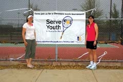 Mendy Stone and Liz Cary stand in front of the Claremore courts where the fourth annual Serve for Youth will be held May 17-19.