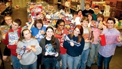 Young volunteers from St. Stephen’s United Methodist Church of Broken Arrow combine forces to help package food for distribution to 450 participating Partner ­Programs that feed the hungry.