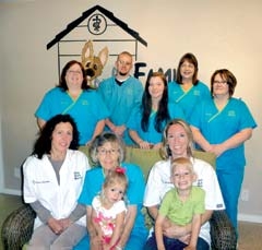 The staff of Family Animal Medicine (L to R): (back row) Mariann Stanley, Aaron Goldesberry, Katie Knoten, Micki DeYong, Karen Drosos, (front row) Dr. Gena Guerriero, Wanda Cline with Jayla Nobles, and Dr. Jenny Nobles with Jaxon Nobles. (Not pictured: Becky Vasey)