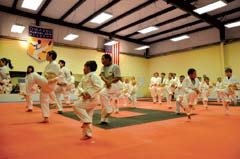 Students learn valuable life lessons including goal setting through martial arts training.