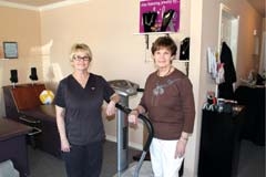 Debby Bailey and Clara Rosencutter show some of the equipment available 
at Classy Curves in Claremore.