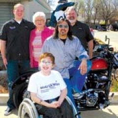 James McClanahan, Myers-Duren Harley-Davidson; Reba McClanahan, Myers-Duren Harley-Davidson; Lynn Hernandez, KMOD; Johnny McClanahan, Myers Duren ­Harley-Davidson, with Wish Ambassador Colby Mitchell.