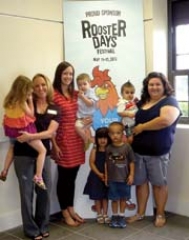 Linnea Plowman (center) was the lucky winner of the ­Rooster Days Egg Hunt, with help from her sister Kenna Moskal (left), friend Valerie Hale, and all of their kiddos.