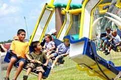 Kids love the annual fun fair at the Muscogee (Creek) ­Nation Festival, featuring carnival rides, inflatables and more.
