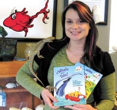 Michelle Zarantonello, education coordinator at the Oklahoma Aquarium, pictured with a bearded dragon and a rose-hair tarantula. The Oklahoma Aquarium’s theme for the 2011 World Oceans Day is Dr. Seuss.