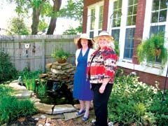 Garden &amp; Pond Tour committee member Barry Cramer (left) and Safenet Services ­executive director Donna Grabow.