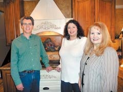 Melody Miles (center) with two ­satisfied clients of Divine Redesign, David and Paula Bachelor.