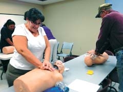 Course participants get “hands-on” experience while learning the fundamentals of life-saving CPR techniques.