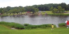 Kids line up along the shores of Claremore Lake in last year’s annual Kids Fishing Derby. Prizes are awarded in each of three age divisions, including the smallest and largest fish. Six free bicycles will also be given away at the end of the event in a drawing of the derby registration tickets.