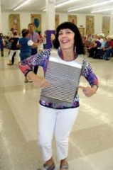 Jana Jae, playing the washboard, joins popular Cajun Band, Bayou Roots, for a little country and Cajun.