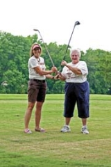 Whether it’s “V” for victory or “V” for Volunteers for Youth, both of these golfers hope to survive 100 holes on July 22 for the 10th annual Volunteers for Youth Smokin’ Hot 100 Golf Marathon. Pictured: Mendy Stone, executive director for Volunteers for Youth, and Judi Mrasek, who has been the top fundraiser for the event over the past eight years.