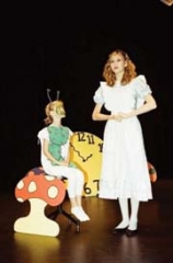Maggie Hazelrigg and Sydney Hazelrigg in “Alice In Wonderland,” presented by Owasso Community Theatre.
