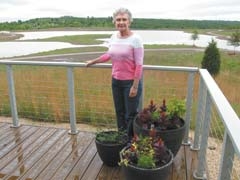 Pearl Garrison, director of communications for the Oklahoma ­Centennial Botanical Garden, stands on the site destined to become one of the country’s premier botanical gardens.